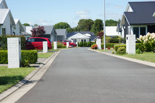 istock Suburban homes lining new orderly street. 2013676376