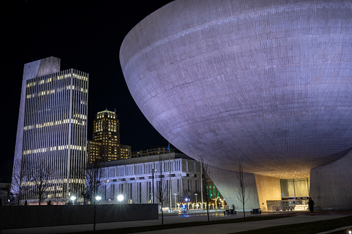 Albany, USA - December 21, 2023. The Egg and government buildings at Capital Complex of Empire State Plaza at night in the downtown Albany, New York, USA