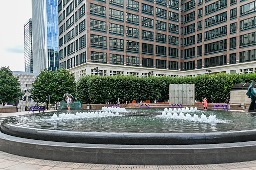 London, UK, 28 August 2023: Cabot Square in the modern Canary Wharf quarter with its banks and skyscrapers, London