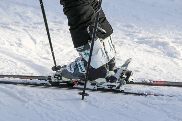 istock Ski boots clicked into skis that are perfectly parallel 2013784764