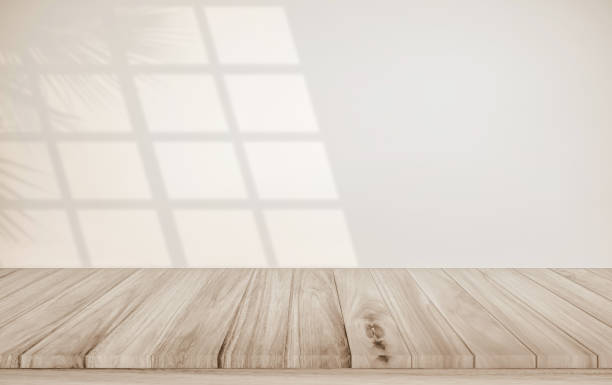 istock Minimalistic abstract gentle light beige background for product presentation with light and shadow of window and leaf curtains on wall. Pastel cream watercolor concrete wall old on floor wood parquet. 2013807447