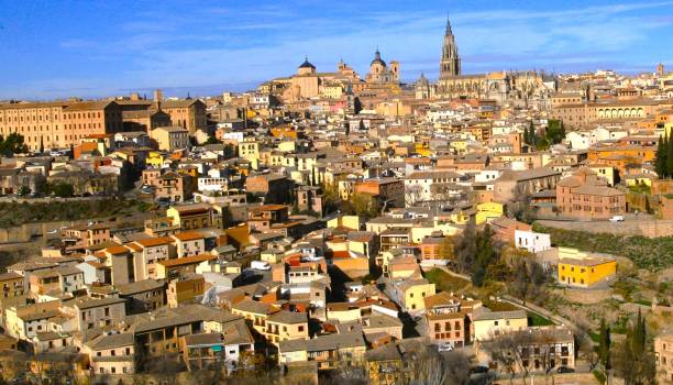 istock Toledo Spain medieval cityscape with yellow and gold  architecture and blue sky 2013808541