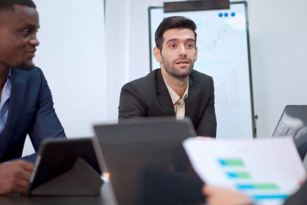 istock Businesspeople discussing in meeting room, 2013823137