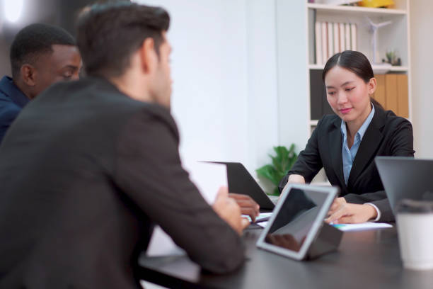 istock Businesspeople discussing in meeting room, 2013823138