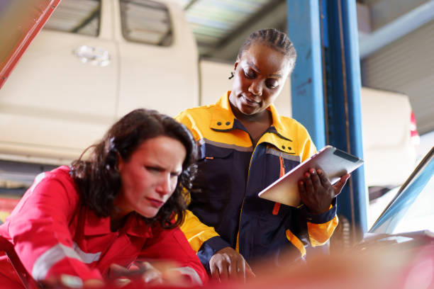 istock Female automotive technicians are working. 2013825756