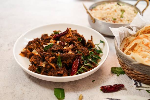istock Kerala beef fry roast served with parotta and ghee rice 2013843895