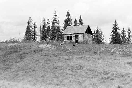 Old log cabin of the wild west in the Yellowstone Ecosystem, western USA, North America. Nearest cities are Jackson, Wyoming, Denver, Colorado and Salt Lake City, Utah.