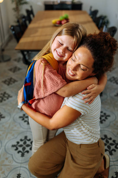 istock Mother and daughter hugging in the morning 2013932160