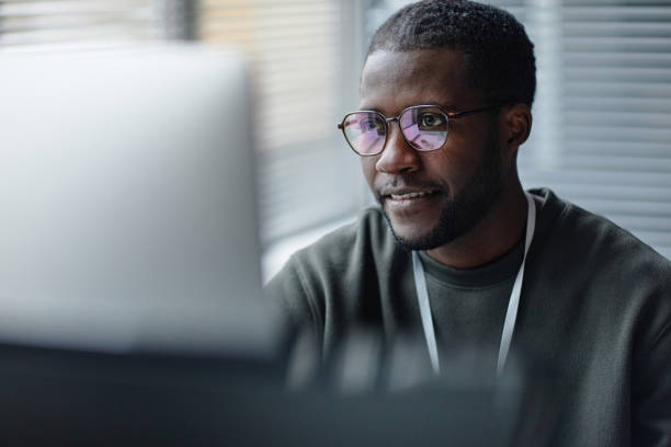 istock Black Young Man Wearing Glasses with Screen Reflection 2013971138