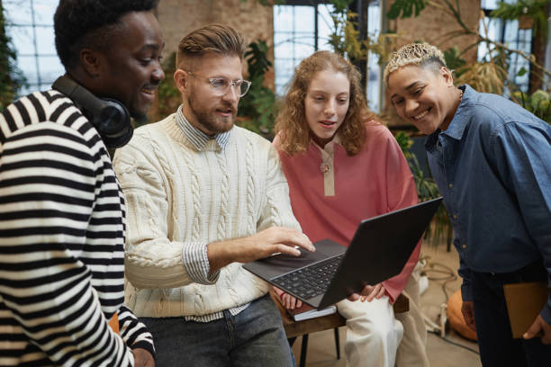 istock Business Team Looking at Laptop Screen 2013972253