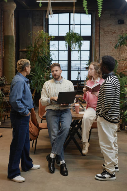 istock Diverse Team of Young Business People Discussing Project 2013972267