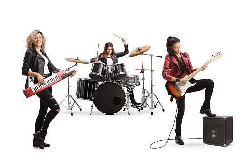Female music band with a drummer and guitarists isolated on white background
