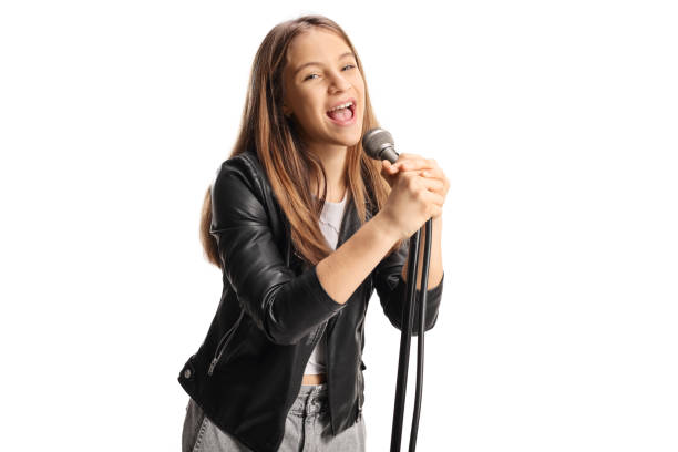 Female teenage singer singing on a microphone