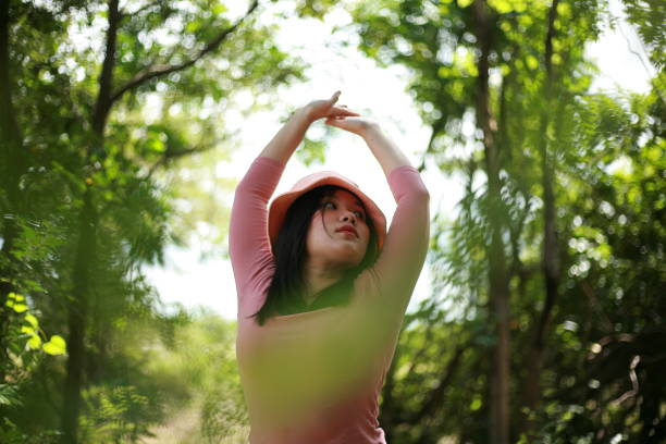 short thai woman in pink