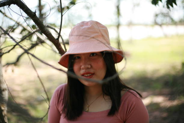 short thai woman in pink