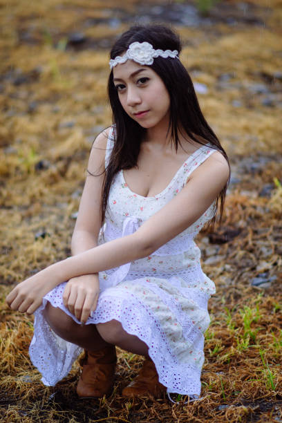 Holding Sunflowers at Sunset in Western USA Attractive Caucasian High School Teen Female Portraits Photo Series