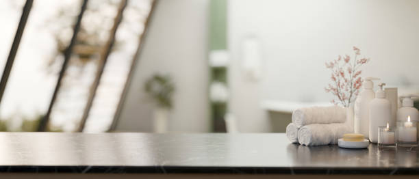 A space for showcasing your product on a black marble table in a modern luxury bathroom.