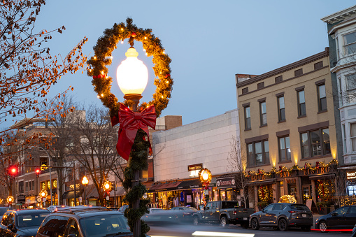 Saratoga Springs, USA - December 22, 2023. Christmas decorated street lamp in downtown Saratoga Springs, New York, USA