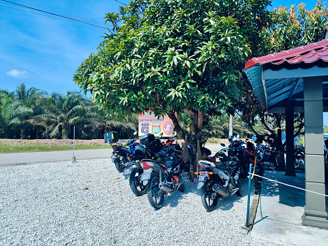 Jeram, Selangor, Malaysia- Feb 11, 2024: Typical motorcycle parking space at Warong Estet Cafe in Jeram, Selangor, Malaysia.