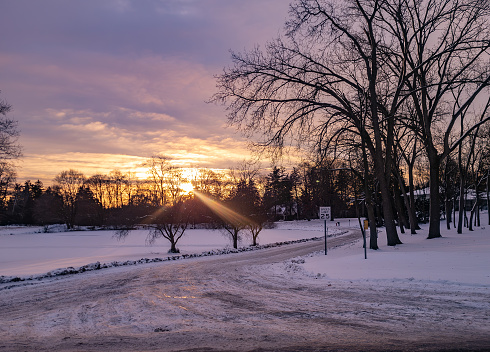 Sunrise in Bloomfield Hills, Michigan on a cloudy day after a snow storm