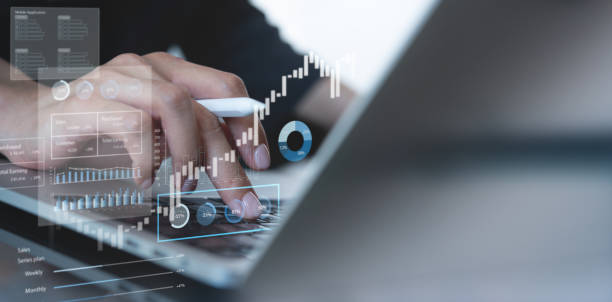 istock Businessman using laptop computer analyzing sales data and financial report, business growth graph chart. digital marketing planning and strategy, financial report, business, finance and investment concept 2014211017