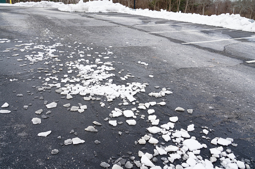outdoor parking lot with ice blocks and snow removed