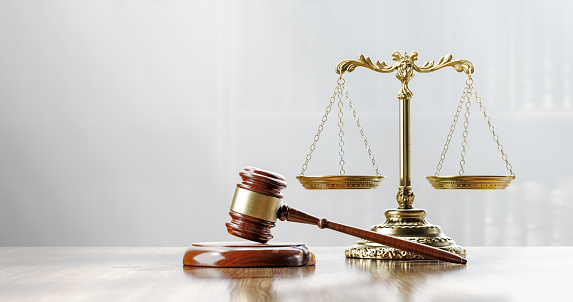Legal concept: Scales of justice and and the judge's gavel hammer as a symbol of law and order.