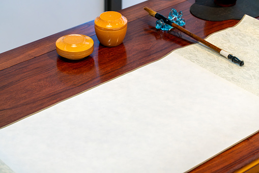 Traditional calligraphy tools on wooden table