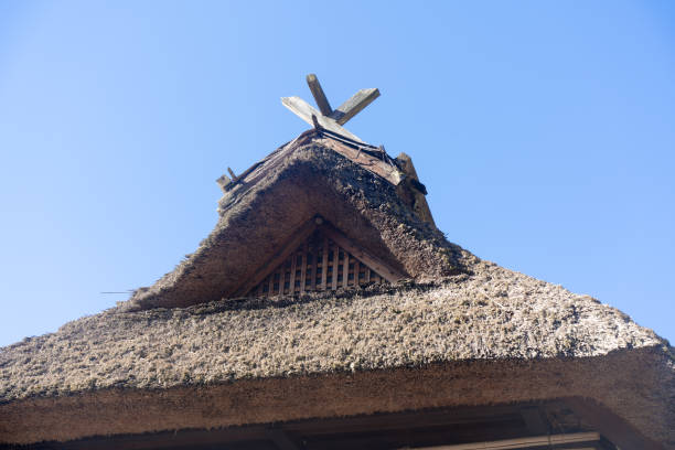 Japanese house with thatched roof and gables