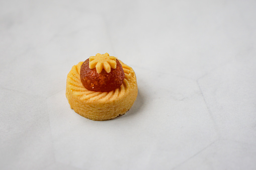 Pineapple Tart or Tart Nenas, a popular cookies in Malaysia during celebration of Eid Mubarak (Hari Raya) isolated on white background with some shadow and selective focus.