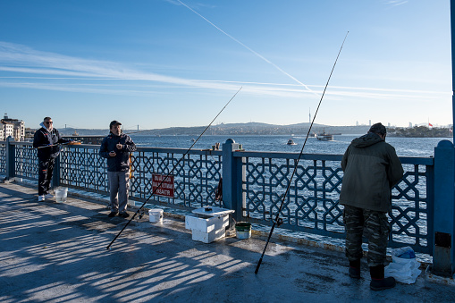 Fishermen at the Galata Bridge, which stretches across the Golden Horn in Istanbul, Turkey, have become an iconic sight. This bridge spans the Golden Horn and has been featured in Turkish literature, theater, poetry, and novels.