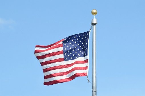 Picture of the American flag on a breezy day.
