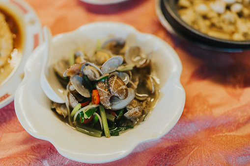 On the table is a mouthwatering main course from Cheung Chau, tempting diners with its flavorful offerings in Dai Pai Dong