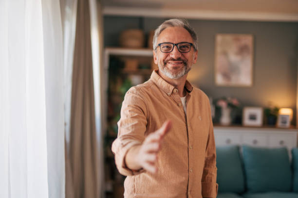 istock Happy smiling businessman giving hand for an handshake. 2014540991