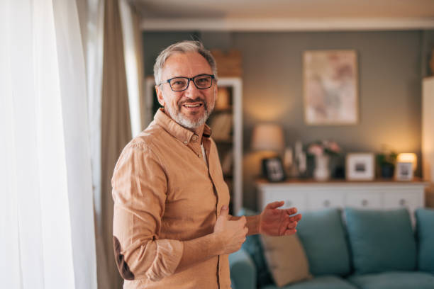 istock close up portrait of a mature explaining something. 2014545711