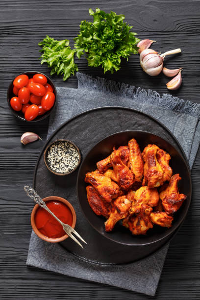 istock spicy crispy grilled chicken wings, top view 2014552543
