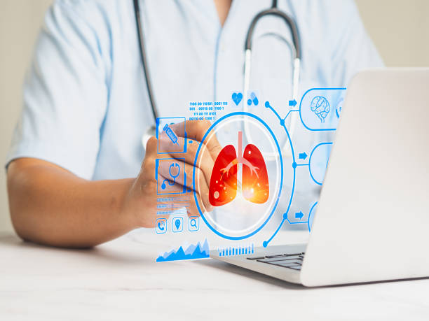 istock Doctor read a lung scan report on a virtual screen while sitting at a desk. 2014554101