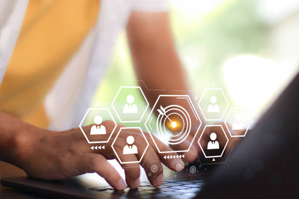 istock White dartboard and White arrow connection linkage with human icon for customer focus target group and customer relation management concept. 2014557778