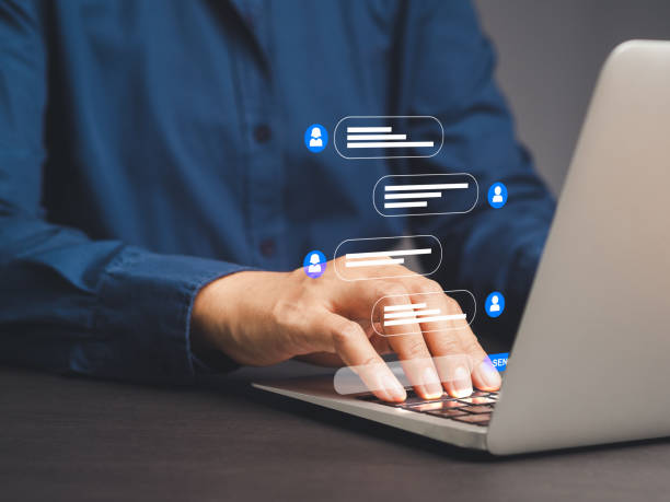 istock Businesswoman typing on a laptop with live chat on application communication. 2014557787