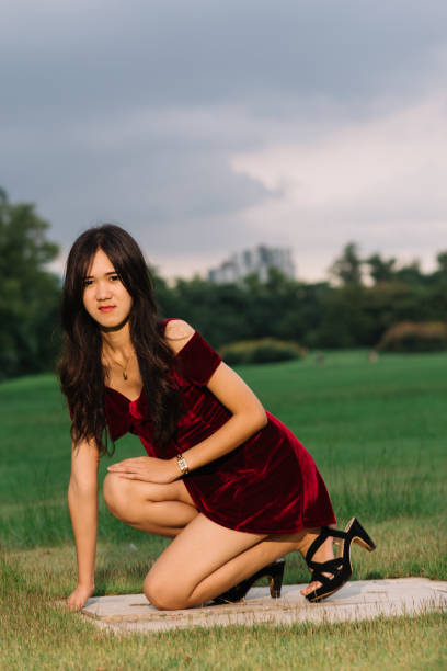 istock cute chinese woman in red 2014576605