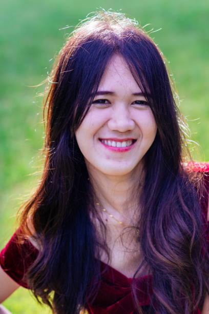 istock cute chinese woman in red 2014580742