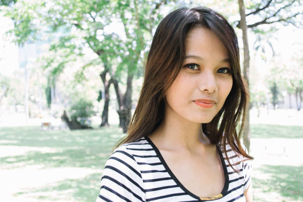 istock thai lady in the park 2014594258