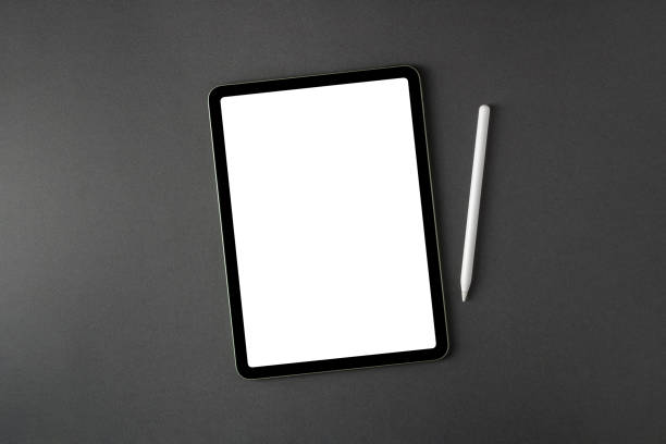 istock Tablet with blank screen and stylus on dark gray office desk 2014637926