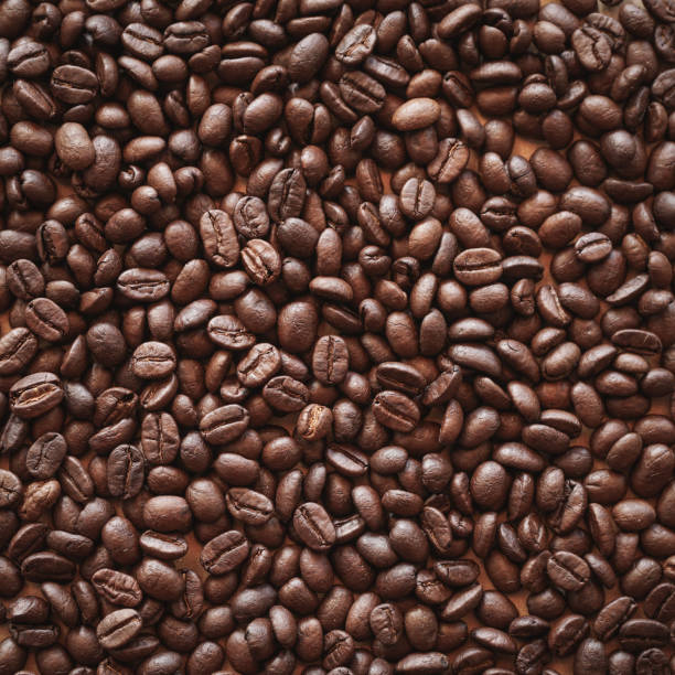 istock Close up of roasted coffee beans background 2014643798