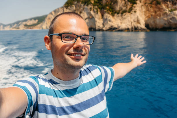 istock Young Man Taking Selfies On The Boat In Parga In Greece 2014652773