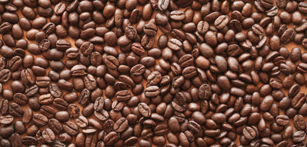 istock Close up of roasted coffee beans background 2014666043