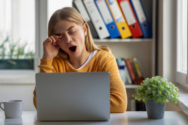 Woman bored and yawning