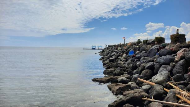 istock An image of the rocky pier at Bangsring Beach Banyuwangi. Selective focus. Wallpapers. Wide view 2014690201