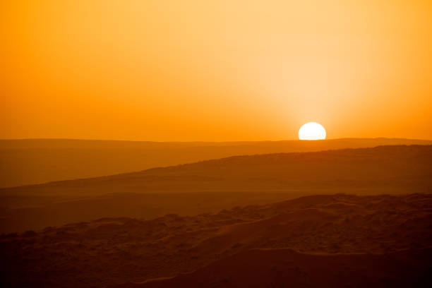 An orange sunset in the distance