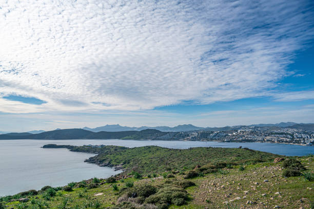 Blue sea, boats, mountains and islands on the Aegean coast. Summer vacation and coastal nature concept